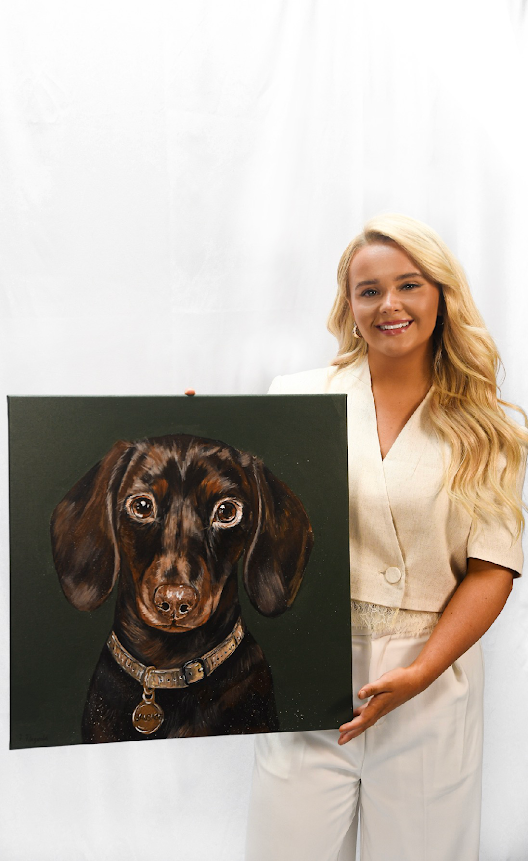 Freya holding a finished dog portrait